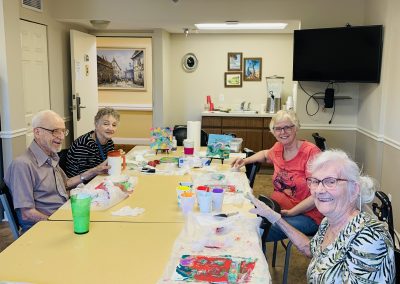 Estates at Carpenters - group of seniors participating in a painting class