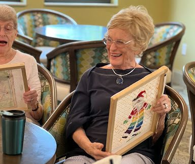 seniors at the estates at carpenters making crafts