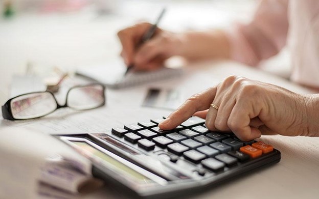 close up of a person using a calculator